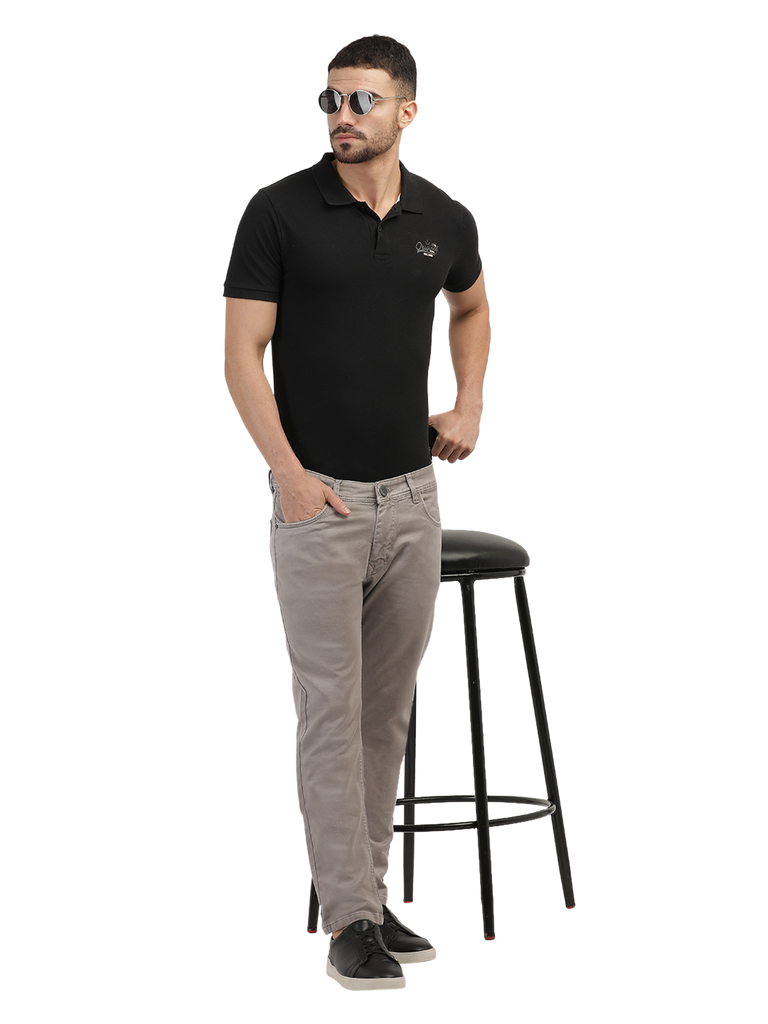 Model wearing Clarke Gable's Light Brown Tinted Skinny Fit Jeans in a casual setting