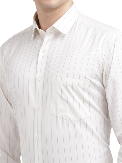 Model wearing Clarke Gable's Light Cream Striped Formal Shirt in a casual setting