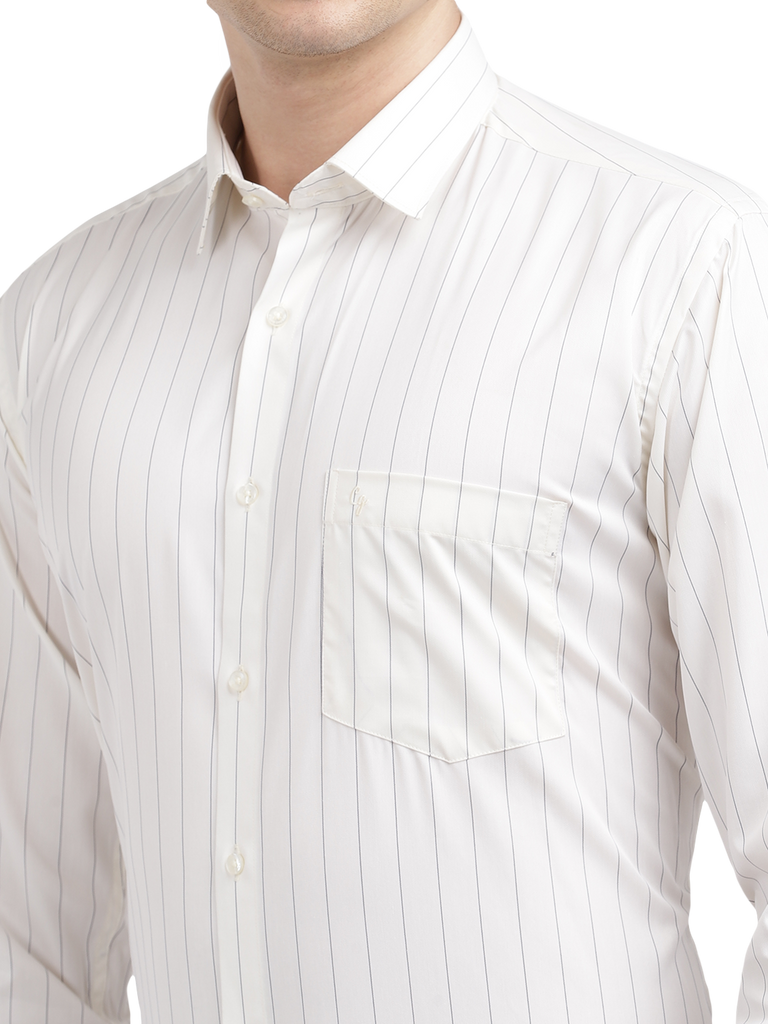 Model wearing Clarke Gable's Light Cream Striped Formal Shirt in a casual setting