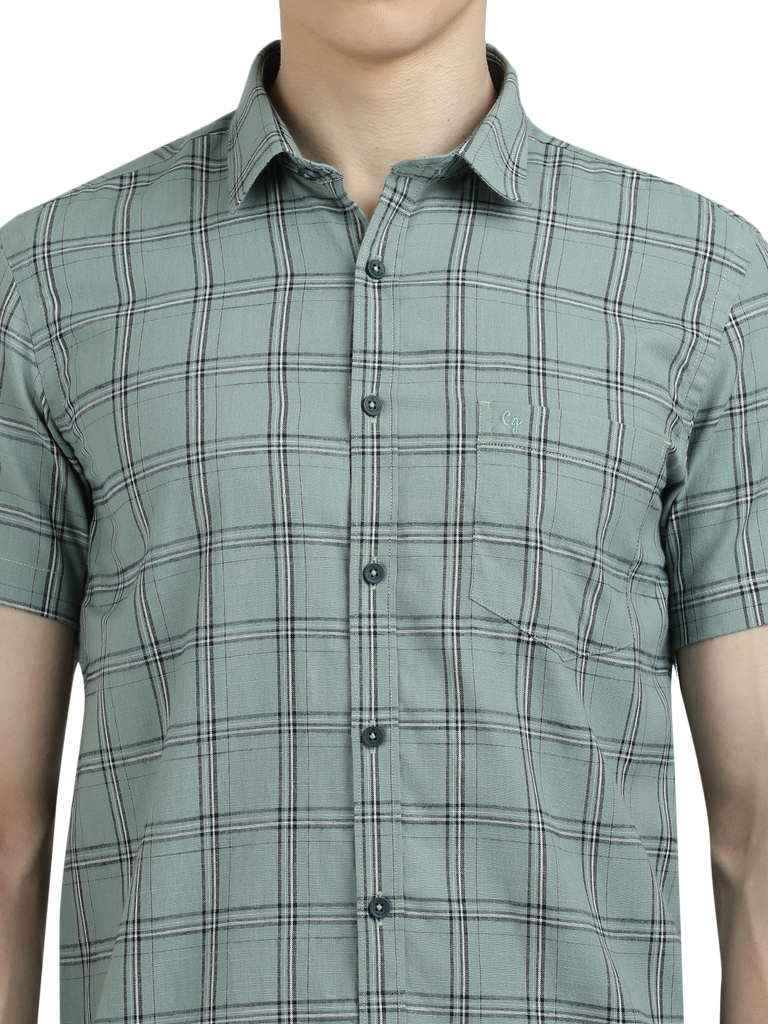 Model wearing Clarke Gable's Light Green Checked Semi Casual Shirt in a casual setting