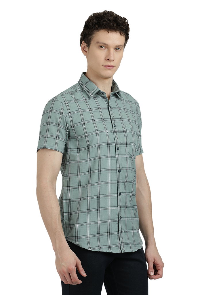 Model wearing Clarke Gable's Light Green Checked Semi Casual Shirt in a casual setting