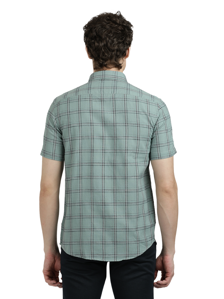 Model wearing Clarke Gable's Light Green Checked Semi Casual Shirt in a casual setting