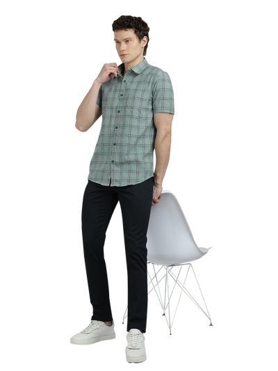 Model wearing Clarke Gable's Light Green Checked Semi Casual Shirt in a casual setting