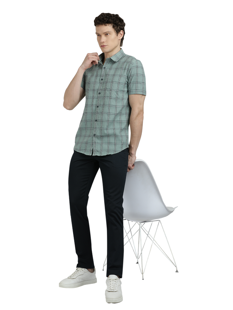 Model wearing Clarke Gable's Light Green Checked Semi Casual Shirt in a casual setting