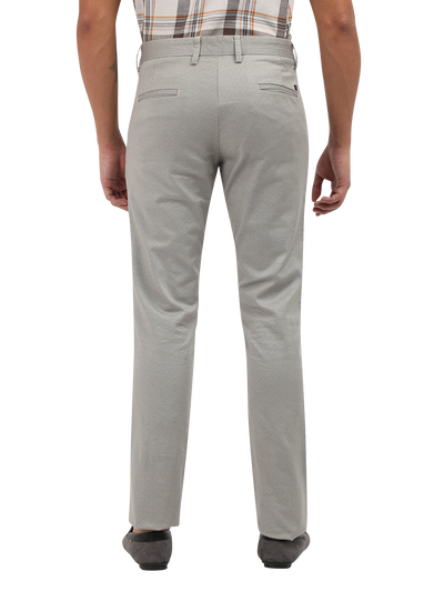 Model wearing Clarke Gable's Light Grey Custom Fit Trousers in a casual setting