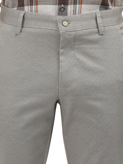 Model wearing Clarke Gable's Light Grey Custom Fit Trousers in a casual setting