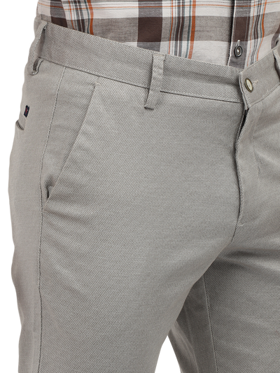 Model wearing Clarke Gable's Light Grey Custom Fit Trousers in a casual setting