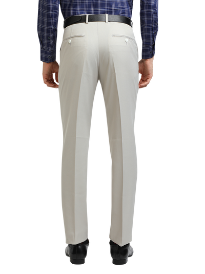 Model wearing Clarke Gable's Light Grey Smart Fit Trousers in a casual setting