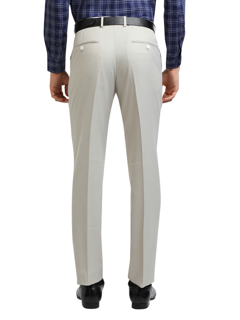 Model wearing Clarke Gable's Light Grey Smart Fit Trousers in a casual setting