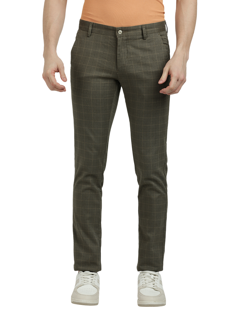 Model wearing Clarke Gable's Light Olive Trim Fit Trousers in a casual setting