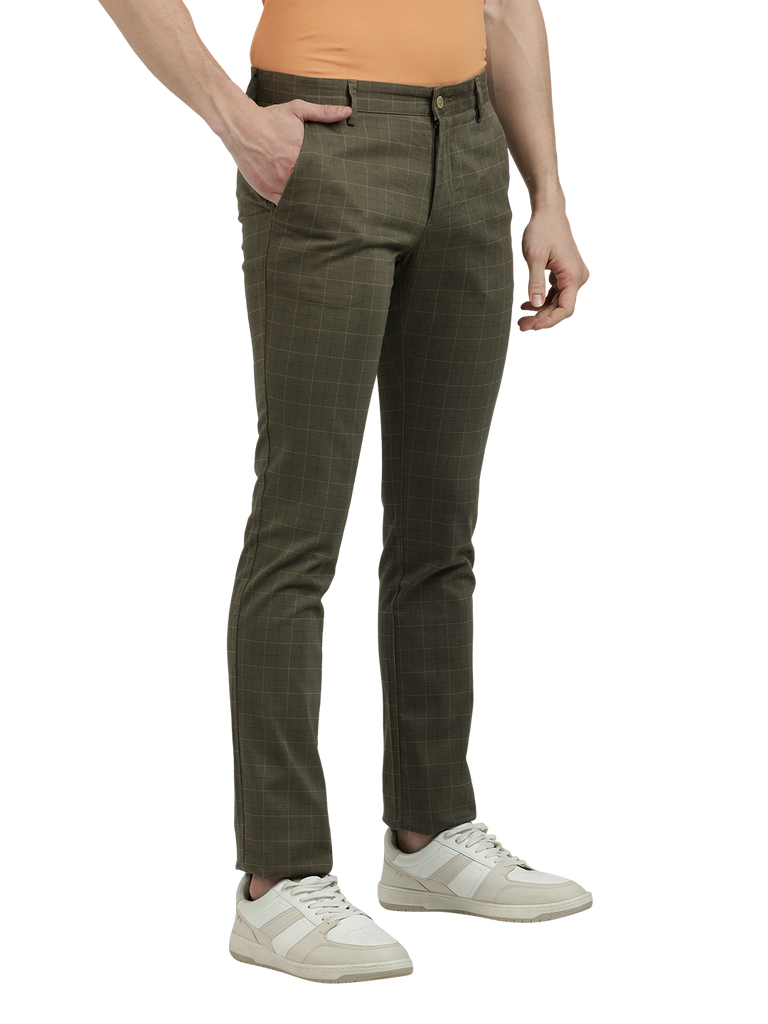 Model wearing Clarke Gable's Light Olive Trim Fit Trousers in a casual setting