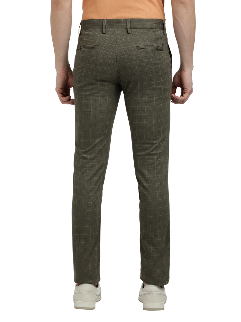 Model wearing Clarke Gable's Light Olive Trim Fit Trousers in a casual setting