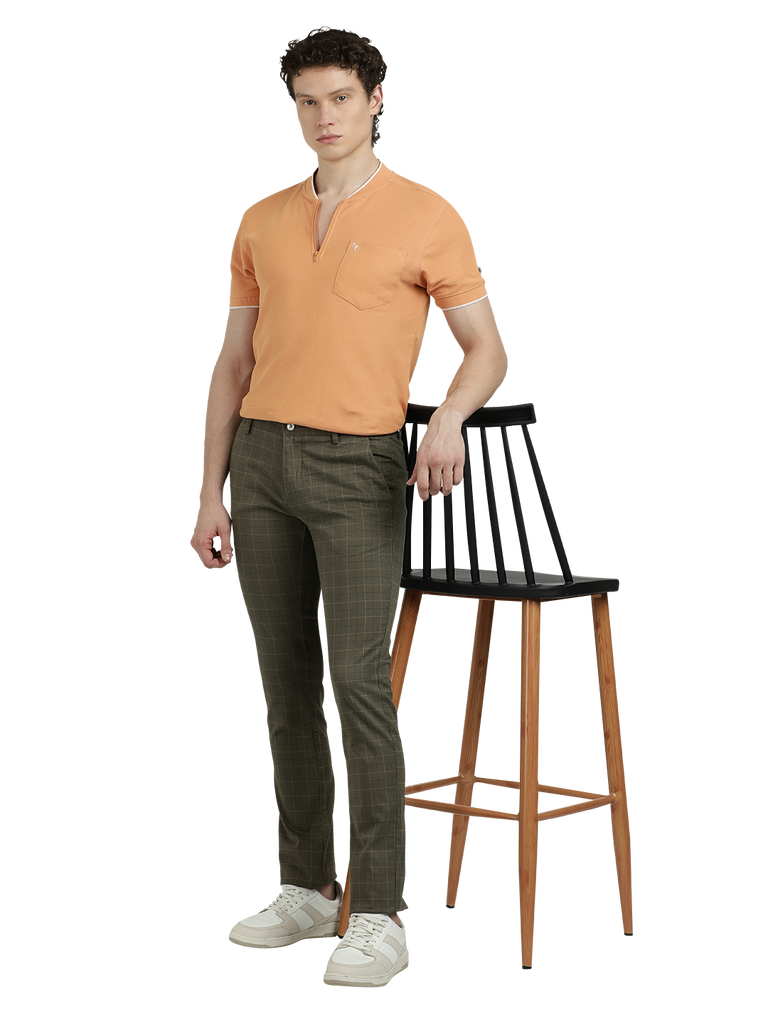 Model wearing Clarke Gable's Light Olive Trim Fit Trousers in a casual setting