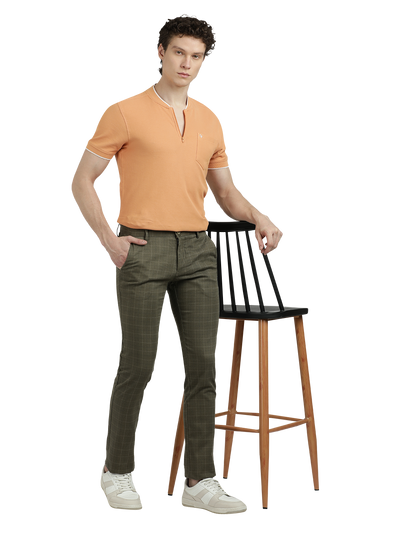 Model wearing Clarke Gable's Light Olive Trim Fit Trousers in a casual setting