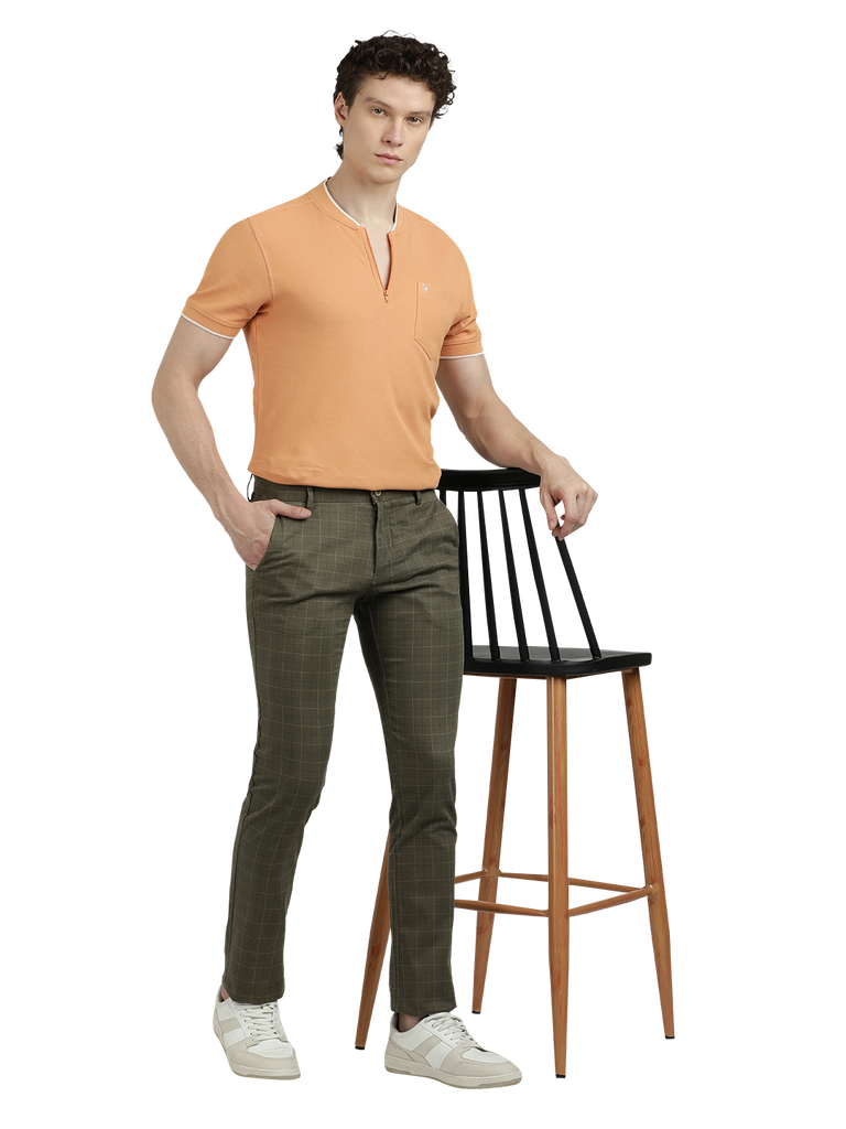 Model wearing Clarke Gable's Light Olive Trim Fit Trousers in a casual setting