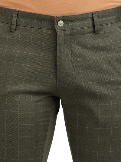 Model wearing Clarke Gable's Light Olive Trim Fit Trousers in a casual setting