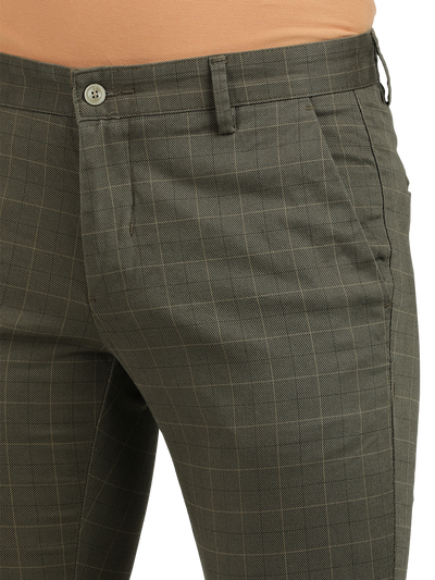 Model wearing Clarke Gable's Light Olive Trim Fit Trousers in a casual setting