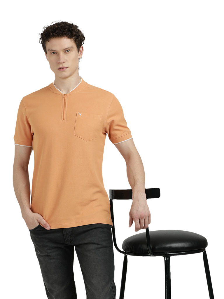 Model wearing Clarke Gable's Light Orange Solid Henley Neck T-Shirt in a casual setting