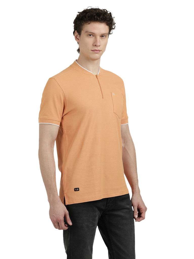 Model wearing Clarke Gable's Light Orange Solid Henley Neck T-Shirt in a casual setting