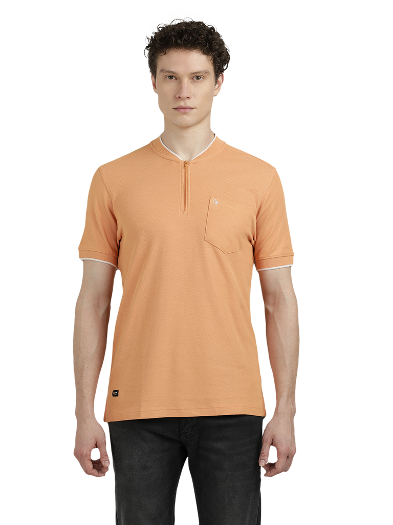 Model wearing Clarke Gable's Light Orange Solid Henley Neck T-Shirt in a casual setting