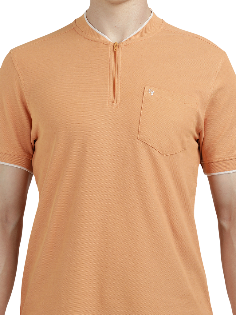 Model wearing Clarke Gable's Light Orange Solid Henley Neck T-Shirt in a casual setting