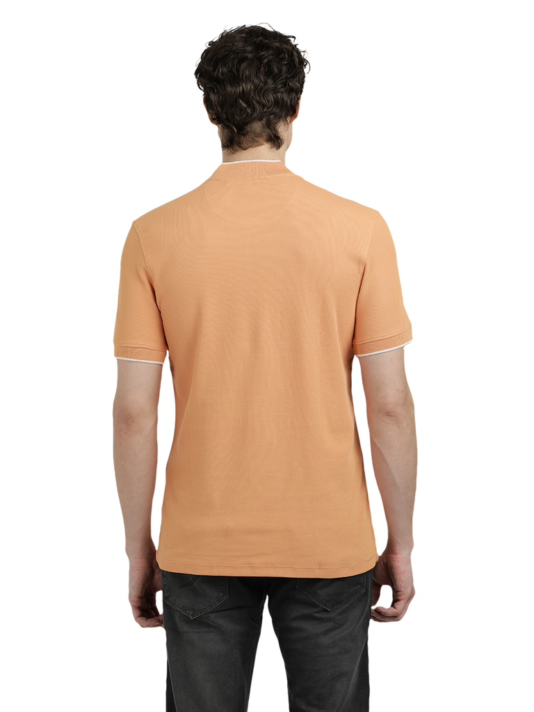 Model wearing Clarke Gable's Light Orange Solid Henley Neck T-Shirt in a casual setting