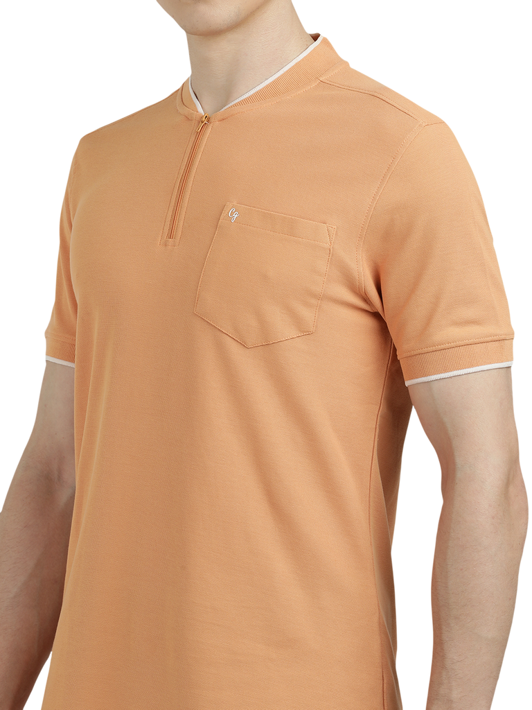 Model wearing Clarke Gable's Light Orange Solid Henley Neck T-Shirt in a casual setting