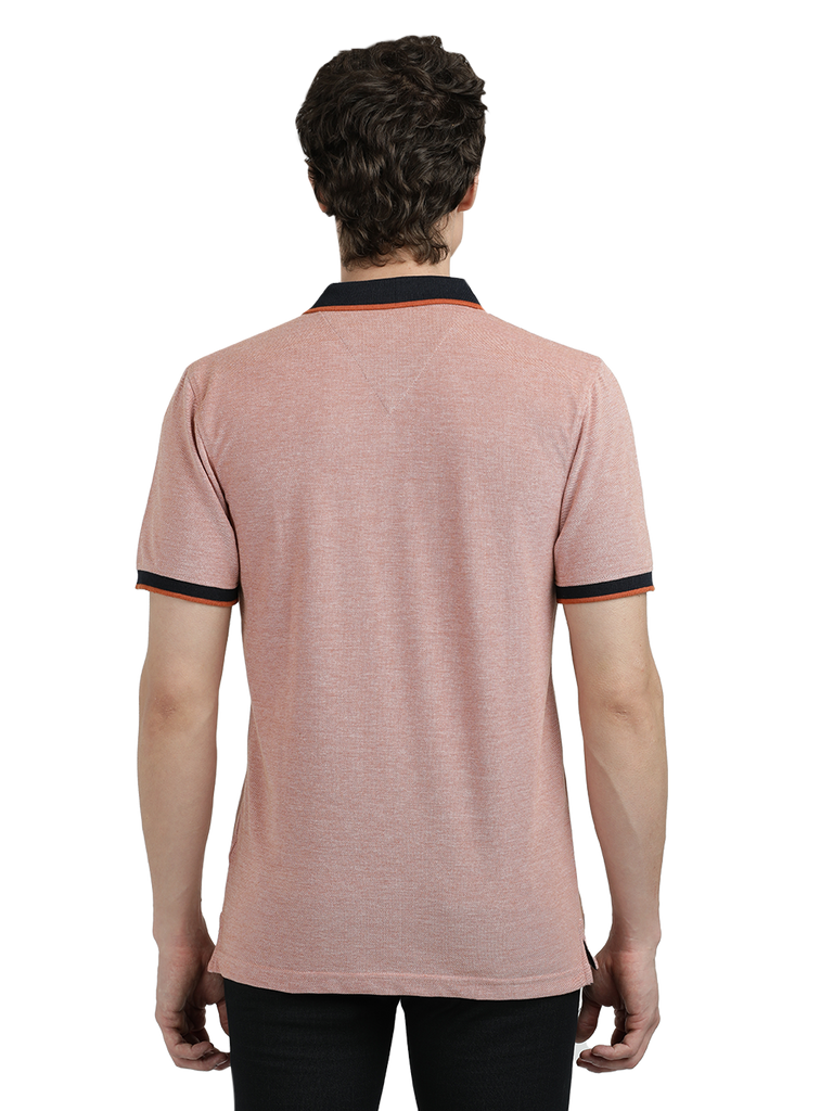 Model wearing Clarke Gable's Light Pink With Black Solid Polo Collar T-Shirt in a casual setting