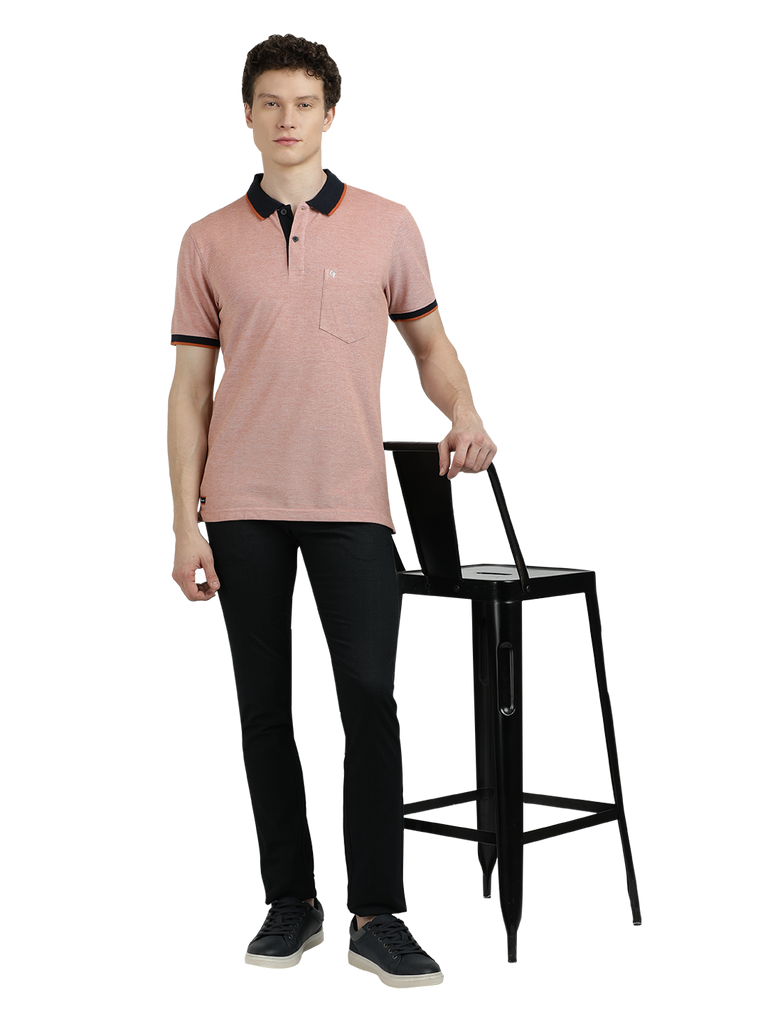 Model wearing Clarke Gable's Light Pink With Black Solid Polo Collar T-Shirt in a casual setting