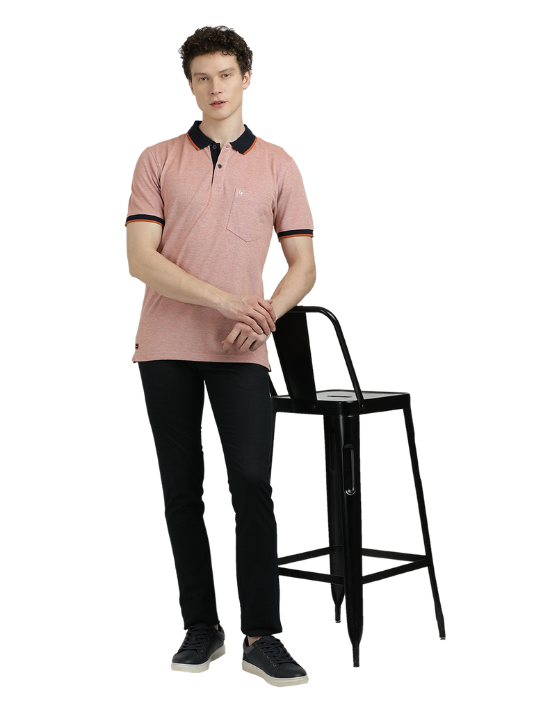 Model wearing Clarke Gable's Light Pink With Black Solid Polo Collar T-Shirt in a casual setting