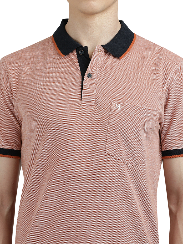 Model wearing Clarke Gable's Light Pink With Black Solid Polo Collar T-Shirt in a casual setting