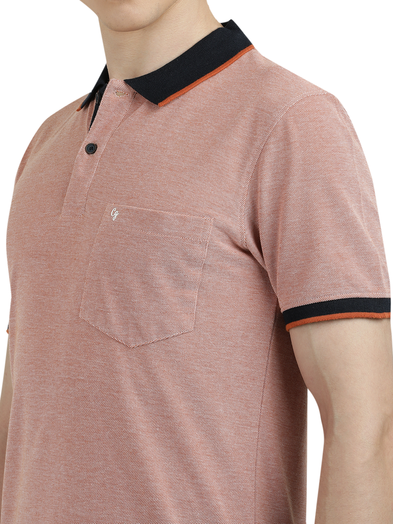 Model wearing Clarke Gable's Light Pink With Black Solid Polo Collar T-Shirt in a casual setting