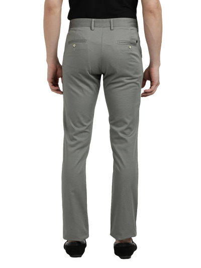 Model wearing Clarke Gable's Light Pista Custom Fit Trousers in a casual setting