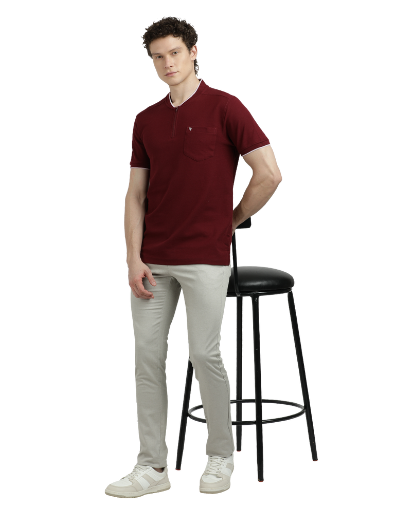 Model wearing Clarke Gable's Maroon Solid Henley Neck T-Shirt in a casual setting