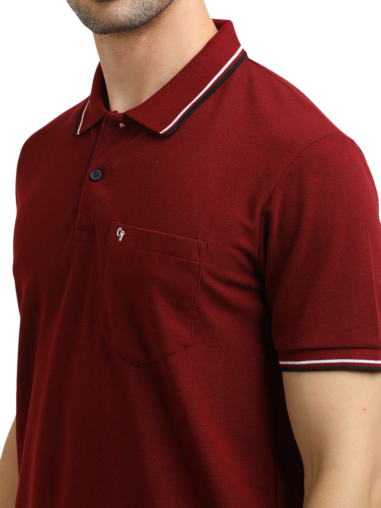 Model wearing Clarke Gable's Maroon Solid Polo Collar T-Shirt in a casual setting