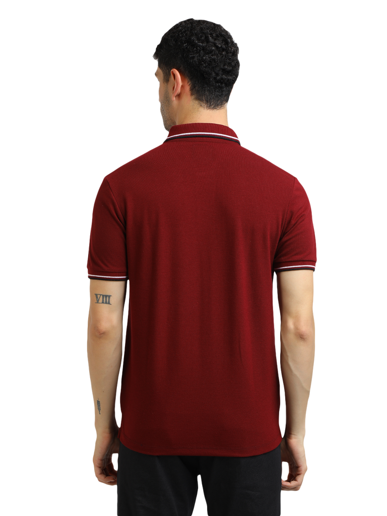 Model wearing Clarke Gable's Maroon Solid Polo Collar T-Shirt in a casual setting