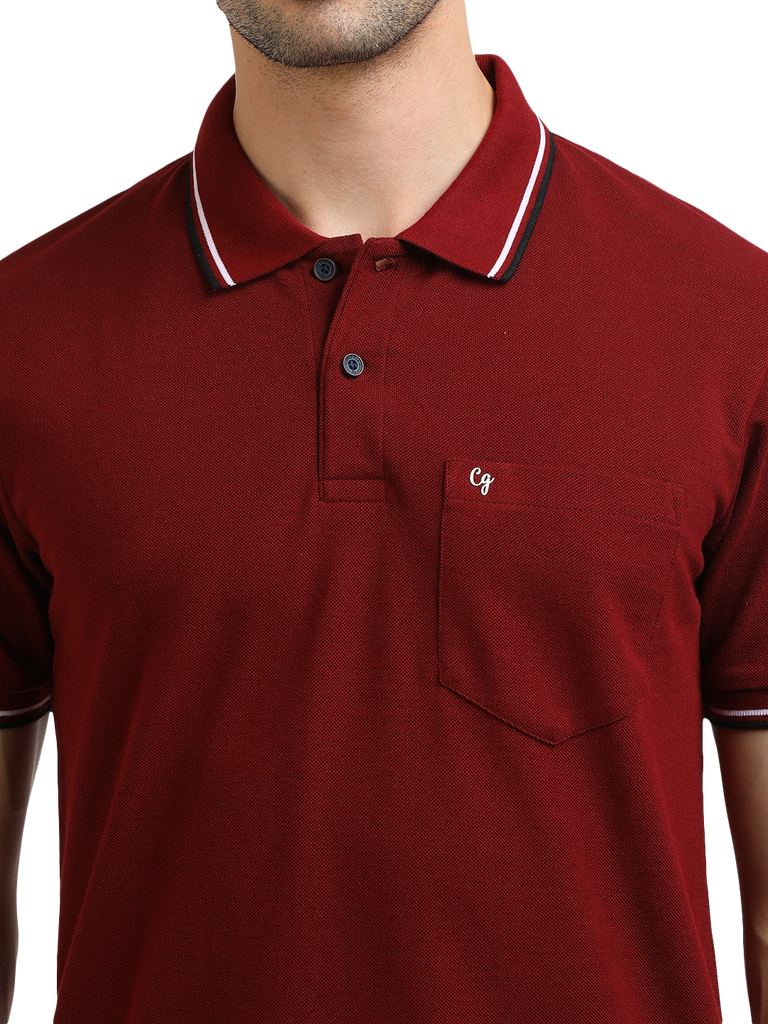 Model wearing Clarke Gable's Maroon Solid Polo Collar T-Shirt in a casual setting