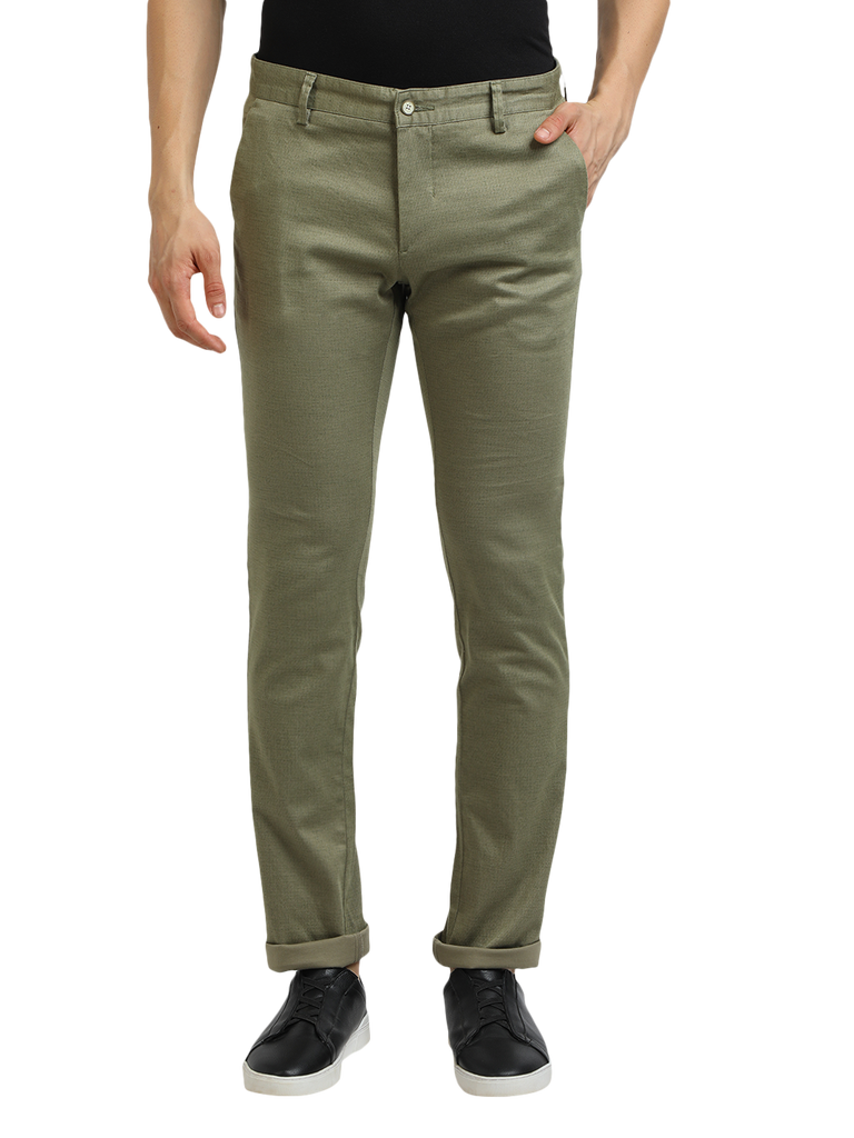 Model wearing Clarke Gable's Mint Trim Fit Trousers in a casual setting