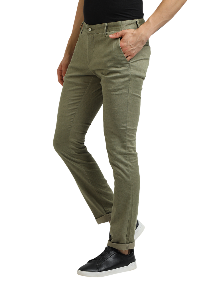 Model wearing Clarke Gable's Mint Trim Fit Trousers in a casual setting