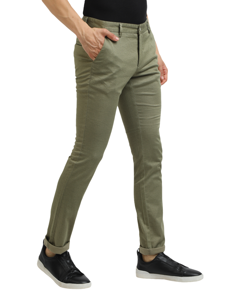 Model wearing Clarke Gable's Mint Trim Fit Trousers in a casual setting