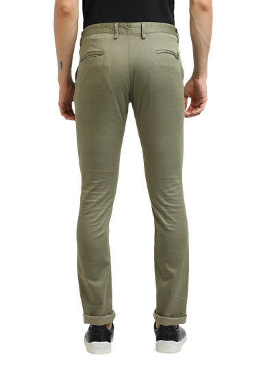 Model wearing Clarke Gable's Mint Trim Fit Trousers in a casual setting
