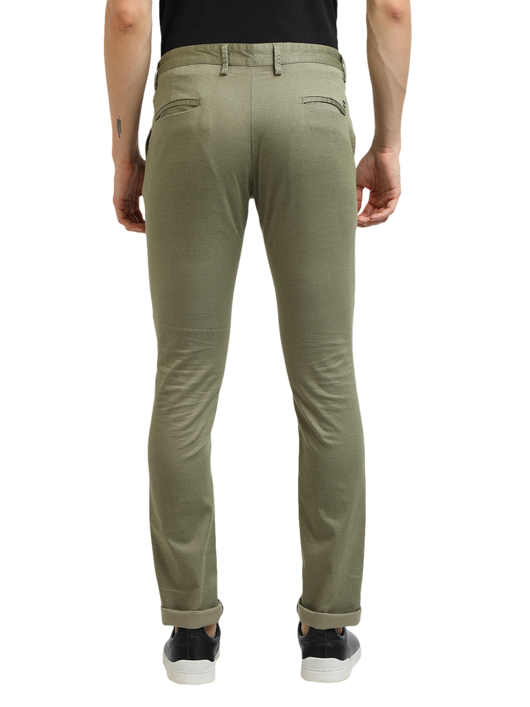 Model wearing Clarke Gable's Mint Trim Fit Trousers in a casual setting