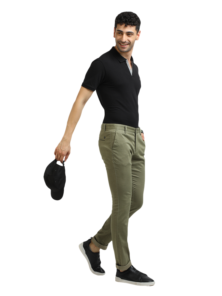 Model wearing Clarke Gable's Mint Trim Fit Trousers in a casual setting