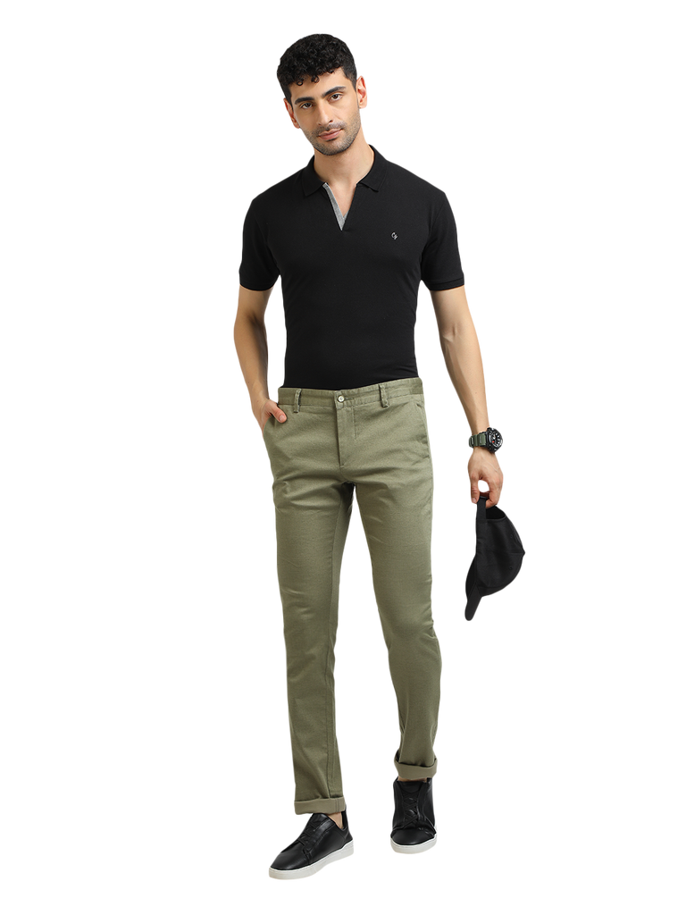 Model wearing Clarke Gable's Mint Trim Fit Trousers in a casual setting