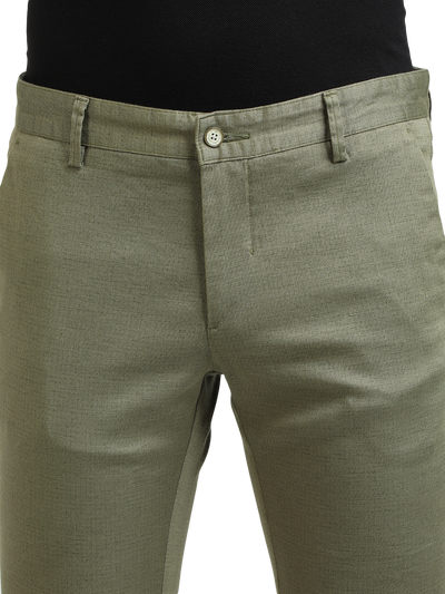 Model wearing Clarke Gable's Mint Trim Fit Trousers in a casual setting