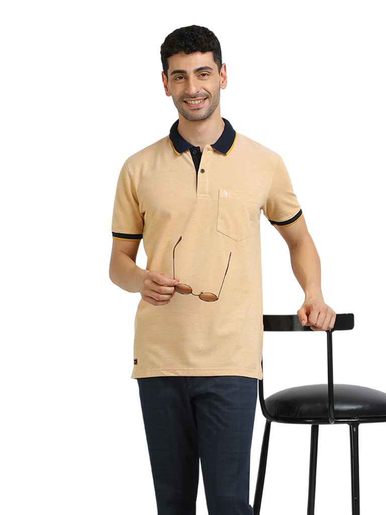 Model wearing Clarke Gable's Mustard Yellow Solid Polo Collar T-Shirt in a casual setting