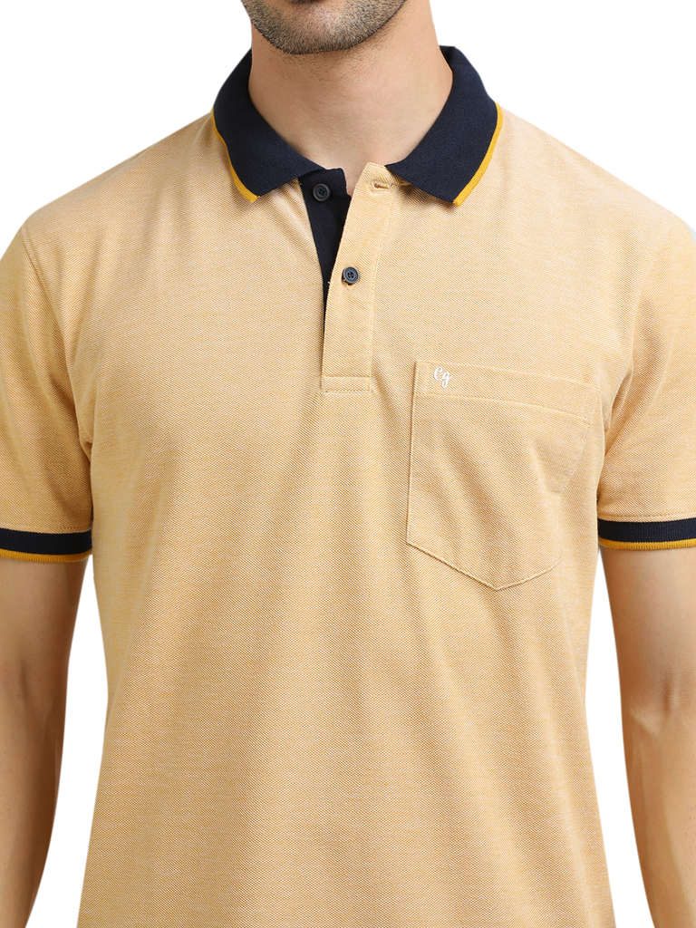 Model wearing Clarke Gable's Mustard Yellow Solid Polo Collar T-Shirt in a casual setting