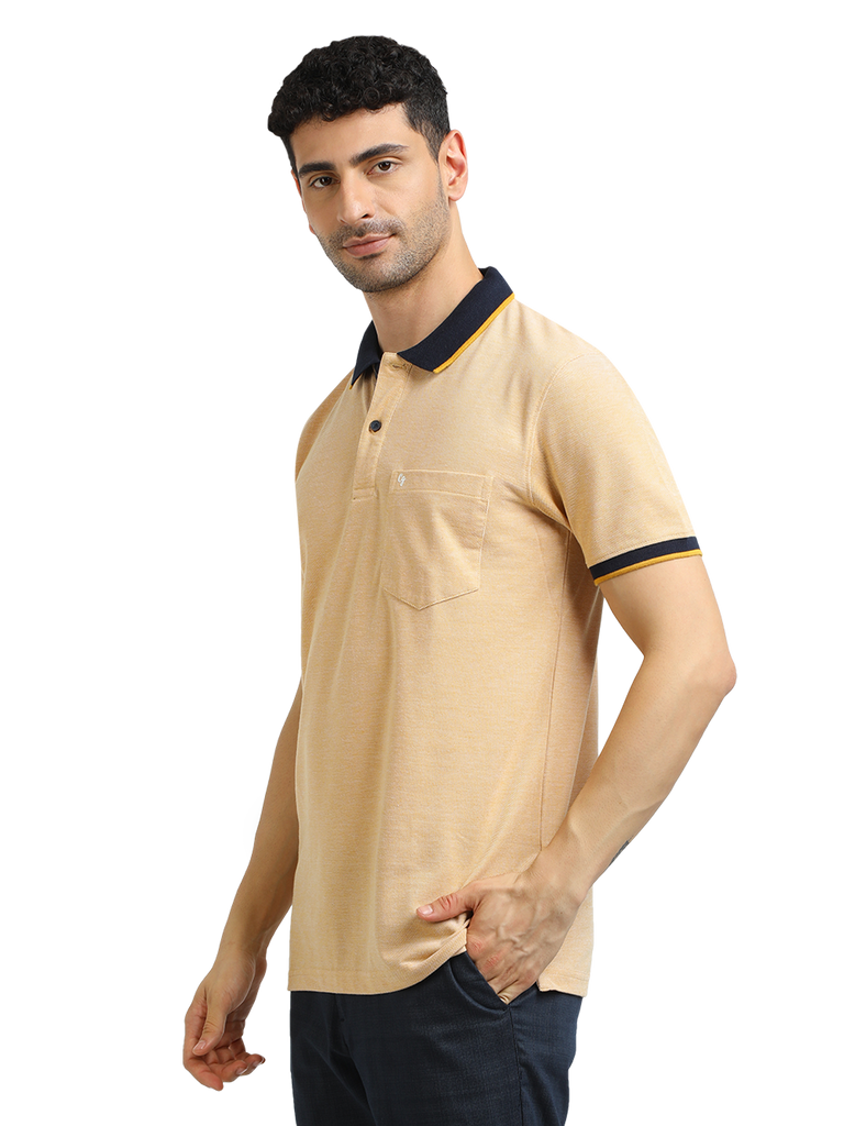 Model wearing Clarke Gable's Mustard Yellow Solid Polo Collar T-Shirt in a casual setting