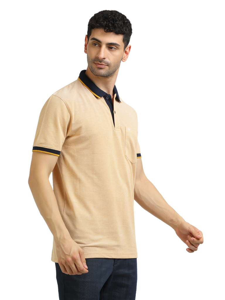 Model wearing Clarke Gable's Mustard Yellow Solid Polo Collar T-Shirt in a casual setting