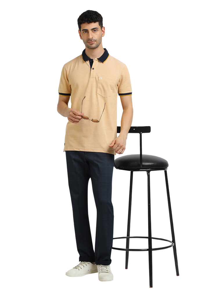 Model wearing Clarke Gable's Mustard Yellow Solid Polo Collar T-Shirt in a casual setting